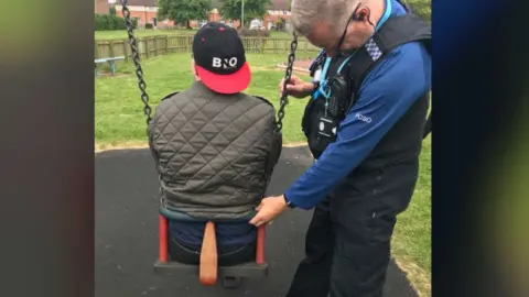 Suffolk Police PCSO with man stuck in swing