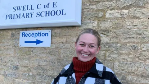 A women standing outside a school