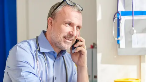 Getty Images Doctor on phone