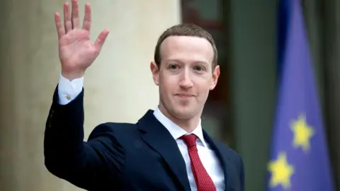 Getty Images Facebook founder Mark Zuckerberg was in Paris on Friday to meet with French president Emmanuel Macron