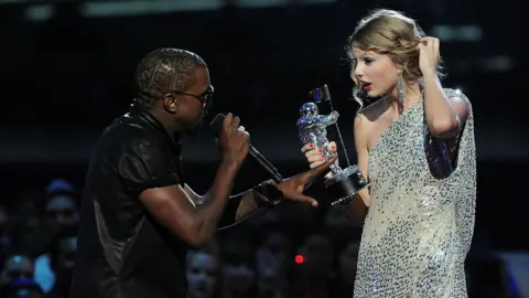 Getty Images Kanye West interrupts Taylor Swift onstage at the 2009 VMAs