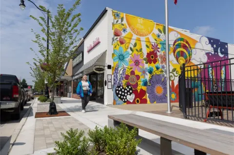 Scott Morgan A pedestrian walks near the town square in Indianola, a city of about 16,000 in the middle of Warren County