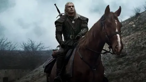 Netflix Henry Cavill as Geralt of Rivia with his horse Roach