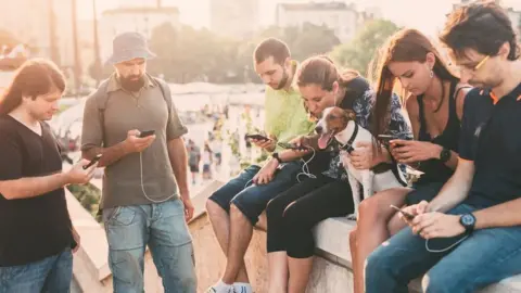 Getty Images People on phones