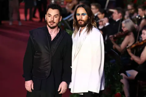 Getty Images US actor and singer Jared Leto (R) and US drummer Shannon Leto of Thirty Seconds to Mars pose for photos at Vogue London event