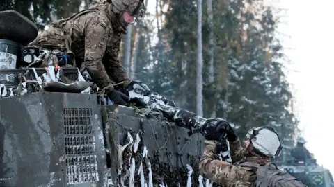 Getty Images British Army servicemen with infantry fighting vehicle 'Warrior' attend military exercise Winter Camp near Tapa, Estonia, 10 February 2024.