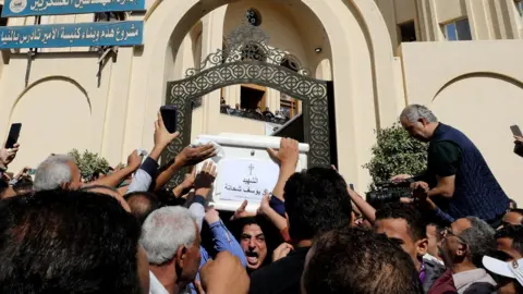Reuters Mourners carry a coffin during the funeral of Coptic Christians who were killed in an attack, in Minya, Egypt November 3, 2018