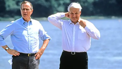 Getty Images US President George HW Bush with Boris Yeltsin in Maryland, US, 1992