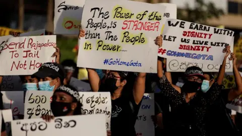 Reuters Demonstrators holding placards take part in a protest against Sri Lankan President Gotabaya Rajapaksa, near the Presidential Secretariat, amid the country's economic crisis, in Colombo, Sri Lanka, April 23, 2022.