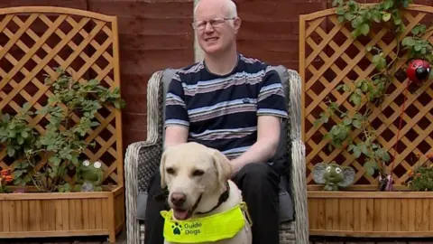 Darren Paddick and his guide dog Penny