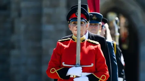 STEVE BABB Procession to Tynwald Hill led by the by the bearer of the Manx Sword of State