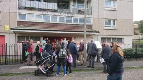 Craig MacLean Muirhouse tenants at a protest about living conditions