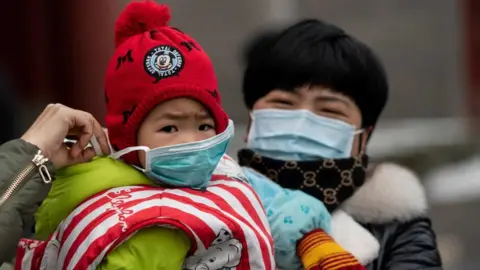 AFP Child with face mask