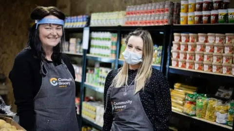 Community Grocery Louise Whittington with her colleague Emily