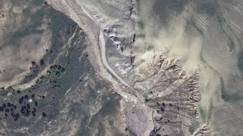 Maxar Technologies/Handout via Reuters Satellite imagery inside Yellowstone National Park shows a washed out road