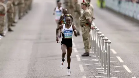 PA Media Obiri races towards the finishing line