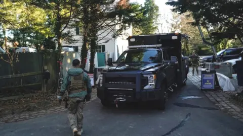 Reuters Secret service personnel at Biden home in Wilmington, 15 Jan 23