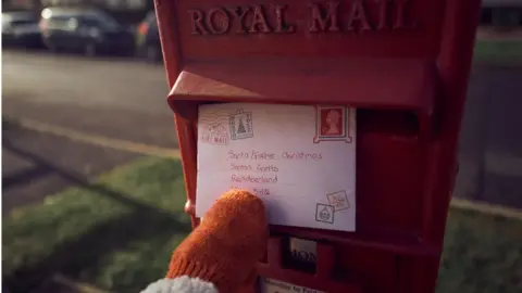 Getty Images Child posts letter to Santa