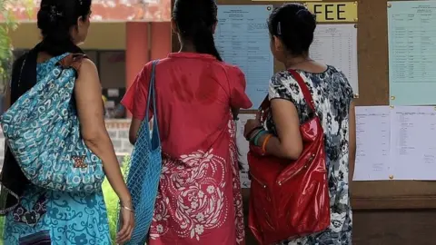 Getty Images Representational image of three female students in a college in India