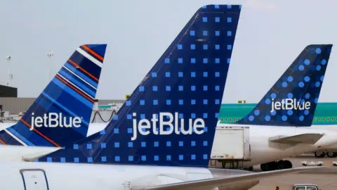 Reuters JetBlue planes at JFK airport