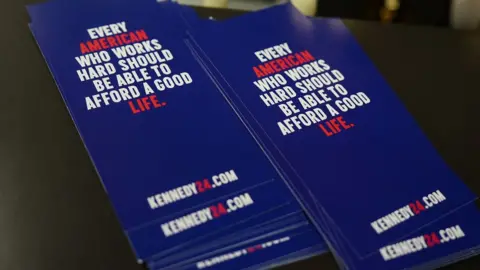 Getty Images Material from Kennedy's campaign reading: "Every American who works hard should be able to afford a good life"