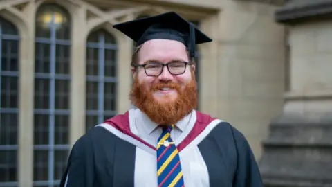 Dr Matt Guy Matt Guy wearing graduation robes