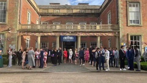 The Wells Academy Staff and students awaiting the arrival of other guests at Colwick Hall