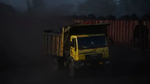 Getty Images A truck loded with coal at the Jharia coal field. According to the World Economic Forum, in 2020, India was home to six out of 10 of the world's most polluted cities.