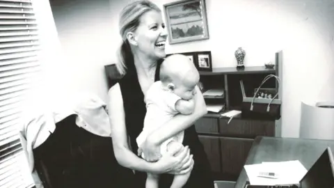 NATASHA STOTT DESPOJA Natasha Stott Despoja holds her baby in her parliamentary office