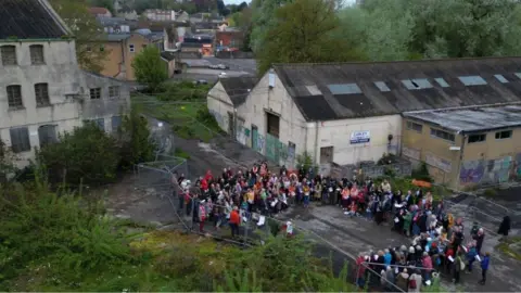 Garfield Austin Aerial photo of 200 supporters gathering at derelict Saxonvale site