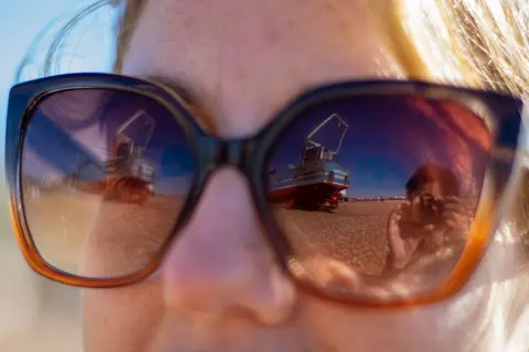 Richard Hughes Scene reflected in sunglasses