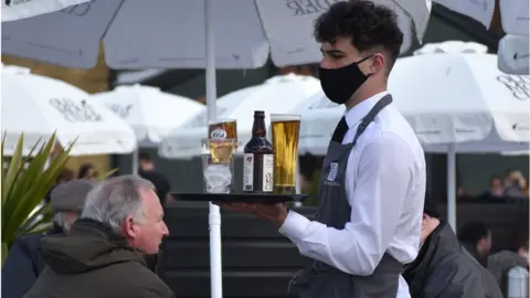 Getty Images A waiter