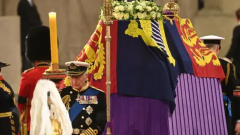 Getty Images King Charles III holds a vigil beside the coffin of his mother, Queen Elizabeth II