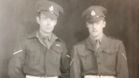 Dougie Tune Dougie Tune (left) in uniform