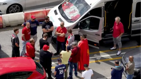 PA Media Liverpool supporters heading for the Champions League Final in Paris wait amongst freight and holiday traffic queues at the Port of Dover in Kent.