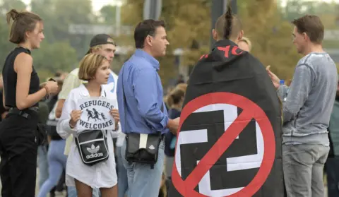 Getty Images People arrive at the free open-air concert in the east German city of Chemnitz, 3 September 2019
