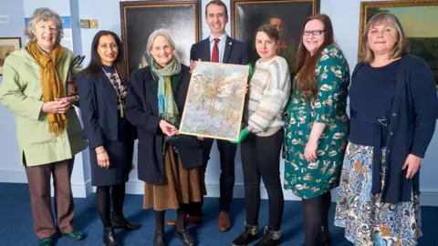 Watford Borough Council  People standing by the painting