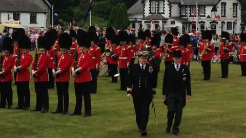 Lieutenant Governor Sir Richard Gozney in front of the Grenadier Guards