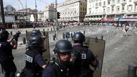 Getty Images England fans clash with police ahead of the game against Russia later today on June 11, 2016 in Marseille, France.