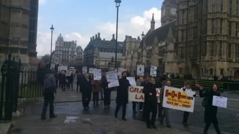Simon Dedman Street lights protest on the march through Westminster
