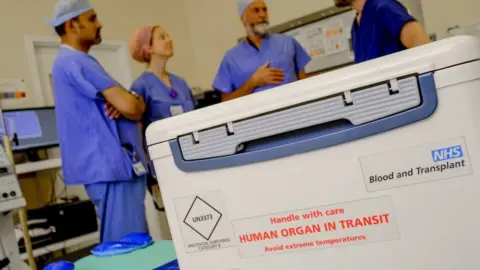 NHS Blood and Transplant Box with organ for transplant reading "handle with care: human organ in transit"