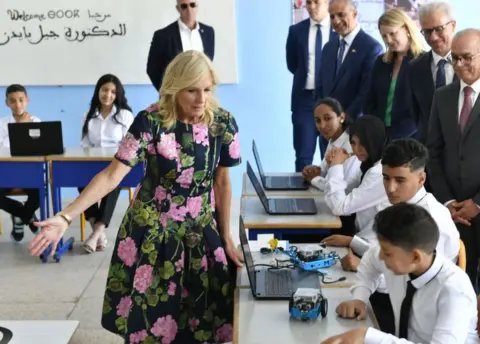 Abu Adem Muhammed/ Getty Images Jill Biden talking to Moroccan students in a classroom. Picture taken 4 June.