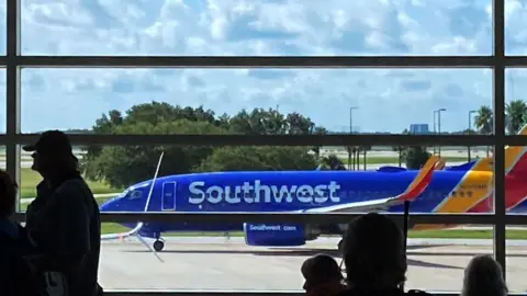 Getty Images A Southwest Airlines plane taxis on the tarmac in preparation for takeoff at Orlando International Airport.