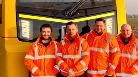 Nexus Four Metro drivers in front of the new-design Metro