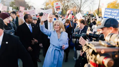 Mark Story Lynn Fitch outside the Supreme Court