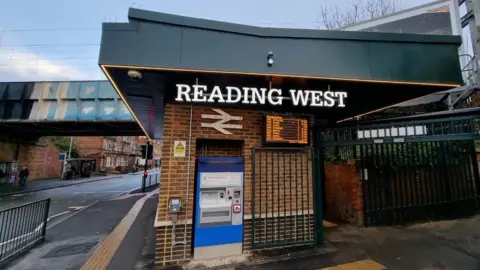 Reading Borough Council Reading West station building, with network rail logo and ticket booth