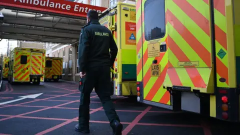 EPA NHS ambulances staff outside a hospital in London