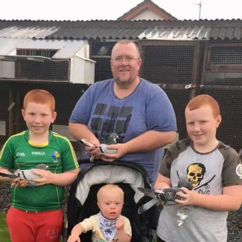 Alan Larkin  Alan Larkin and his sons Harry, Tom and Joseph hold some of their pigeons