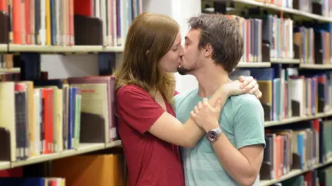 Getty Images Students kissing