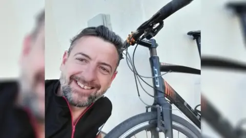 Martin Winward man take selfie next to bike